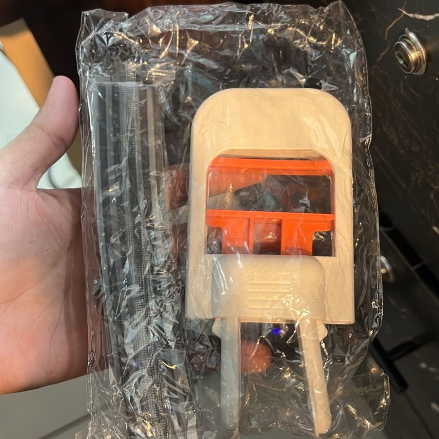 Mini sponge mop standing upright on a countertop