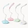 LED desk lamp with flexible neck on a plain background