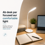 LED desk lamp glowing on a study table at night