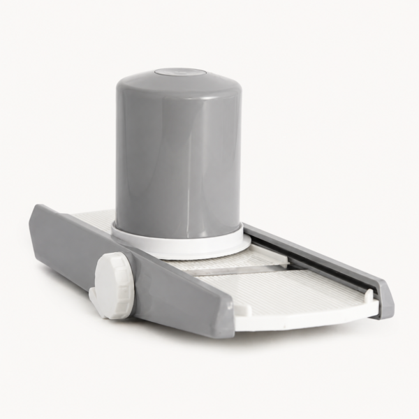 Vegetable slicer chopper standing upright on a plain background