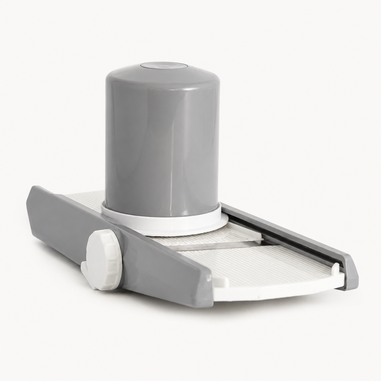 Vegetable slicer chopper standing upright on a plain background