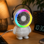 Rechargeable mini fan glowing with RGB colors in a dark room