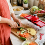 Woman using 10 in 1 vegetable cutter to slice potatoes in kitchen