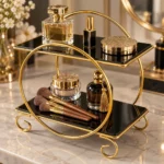 Detail view of golden 2 tier makeup and perfume organizer with cosmetic bottles