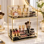 Two tier golden vanity organizer filled with makeup brushes, lipsticks and beauty products