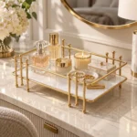 Close up of golden multipurpose vanity display rack in front of a round mirror
