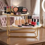 Offset golden 2 tier vanity rack styled with lipsticks, compacts and makeup products