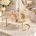 Golden cosmetic storage rack styled with makeup and floral decor