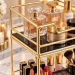 Close up of gold metal 2 tier cosmetic rack storing perfume bottles and skincare products