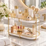 Golden 2 tier vanity and perfume storage rack styled on a vanity table with florals